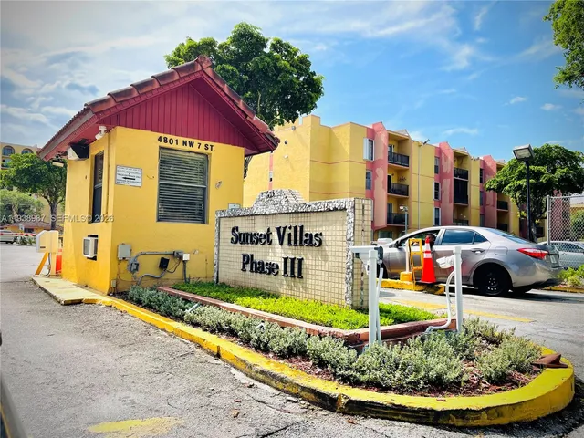 a view of multiple house with a swimming pool