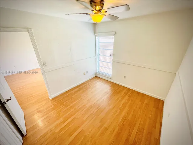 a bathroom with a sink a toilet a mirror and shower