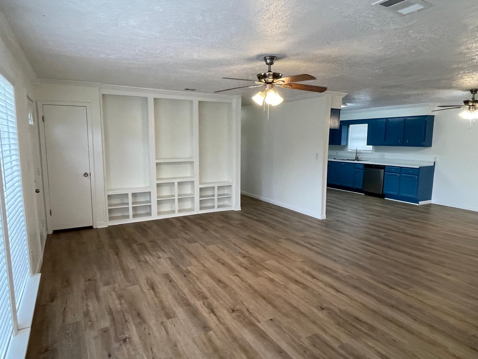 335 Carroll Road Richmond, TX 77469 - Photo 10 of 25 wooden floor in an empty room with a window