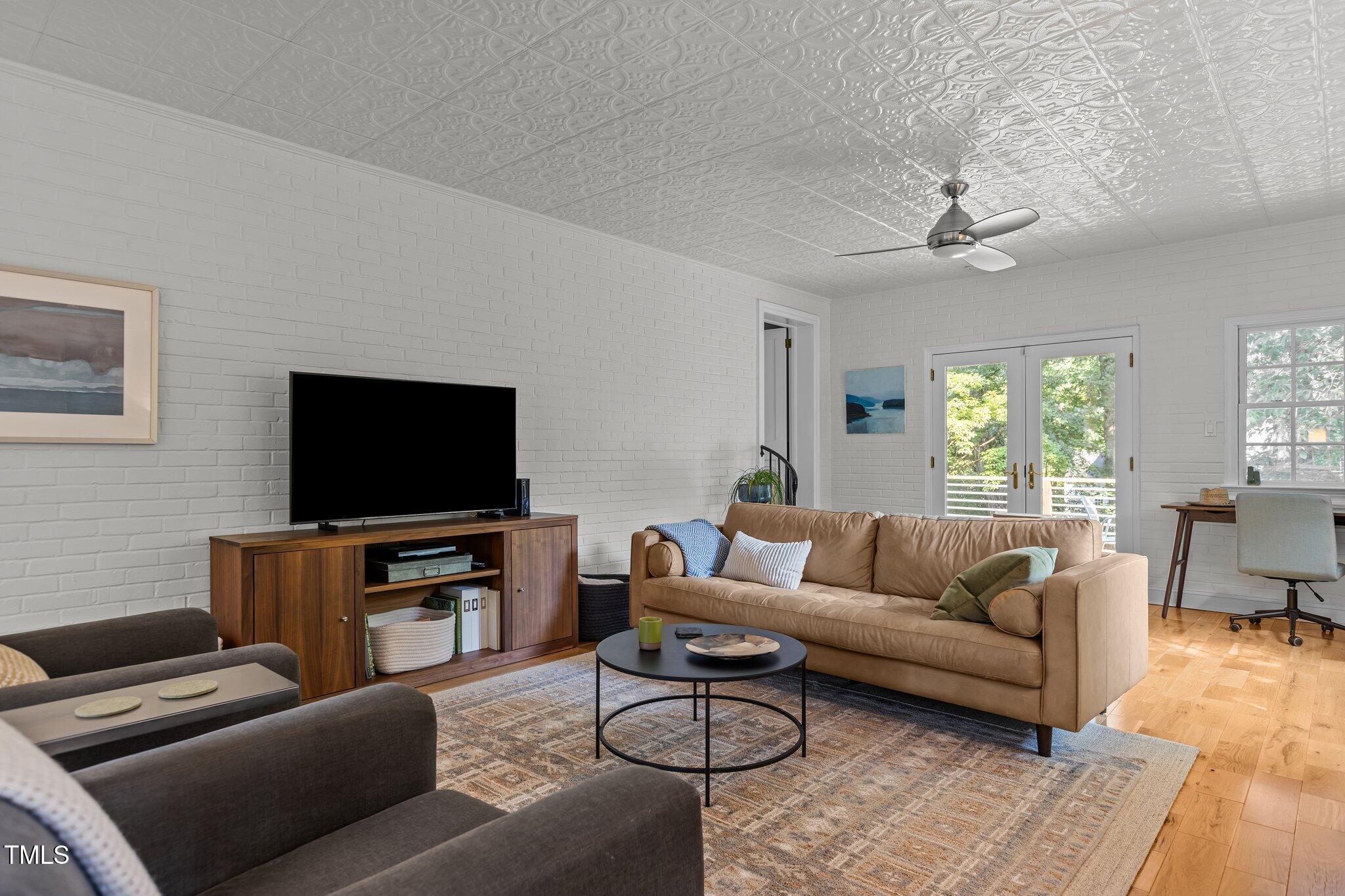 2706 Stuart Drive Durham, NC 27707 - Photo 11 of 26 a living room with furniture and a flat screen tv