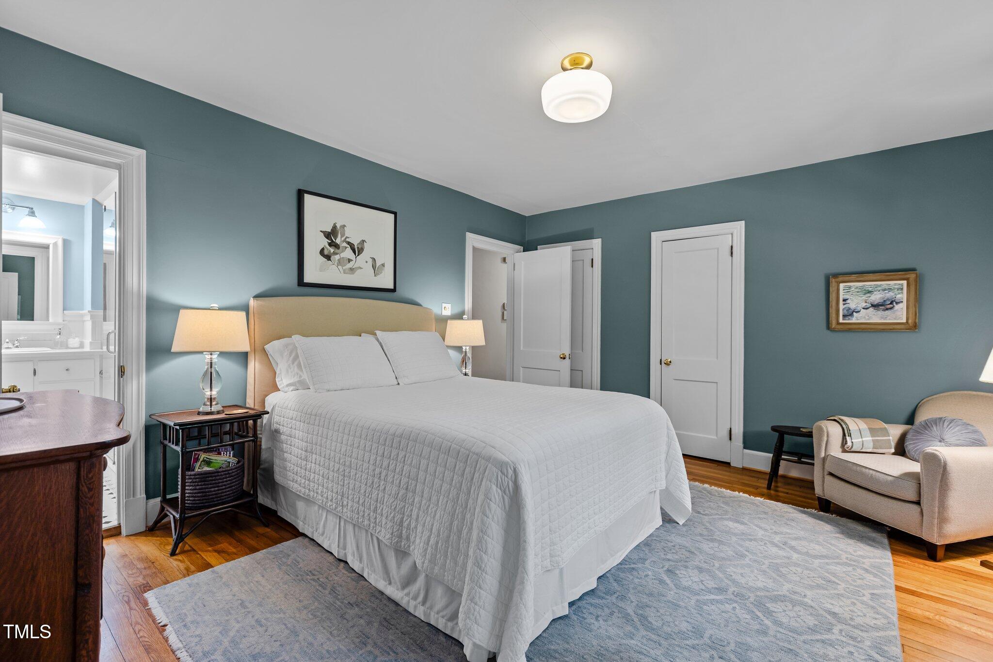 2706 Stuart Drive Durham, NC 27707 - Photo 16 of 26 a bedroom with a bed and a couch