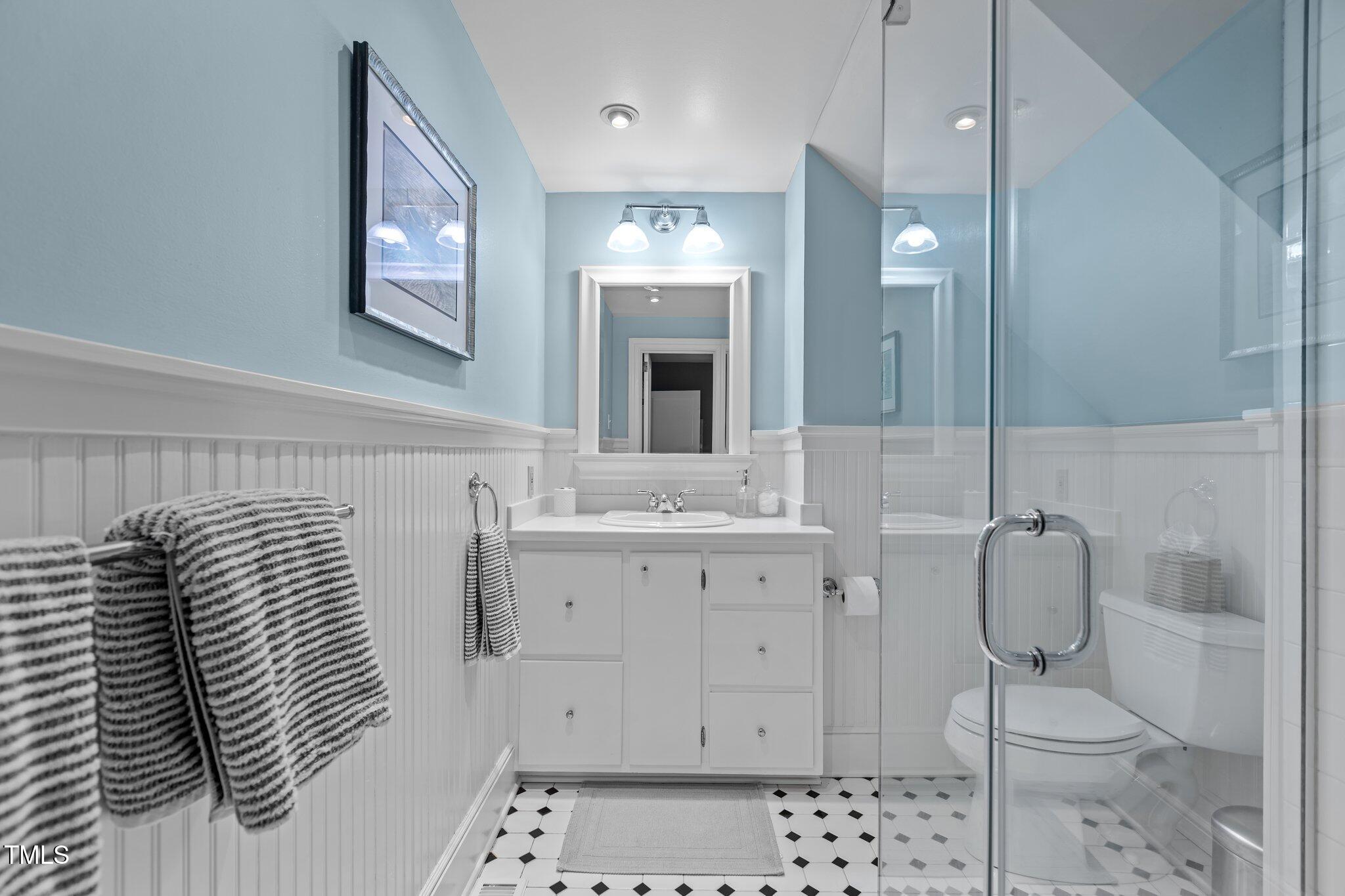 2706 Stuart Drive Durham, NC 27707 - Photo 17 of 26 a bathroom with a sink toilet and shower