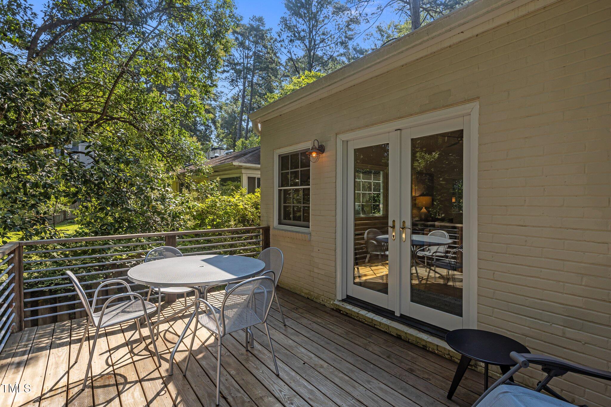 2706 Stuart Drive Durham, NC 27707 - Photo 20 of 26 a backyard of a house with barbeque oven table and chairs