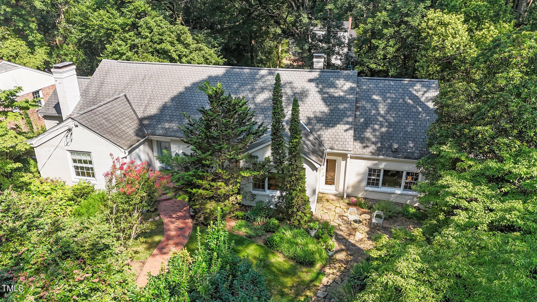 2706 Stuart Drive Durham, NC 27707 - Photo 2 of 26 an aerial view of a house with a yard and garden