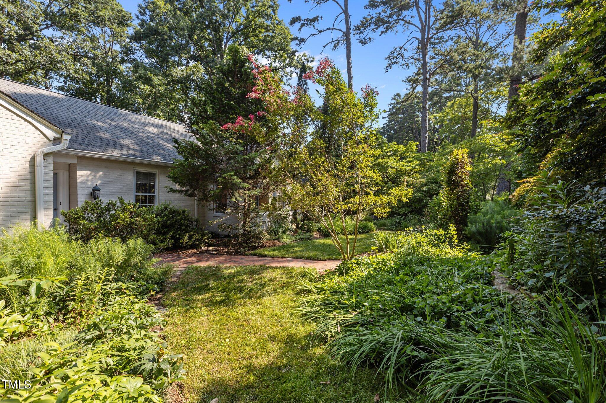 2706 Stuart Drive Durham, NC 27707 - Photo 25 of 26 a view of a house with a small yard