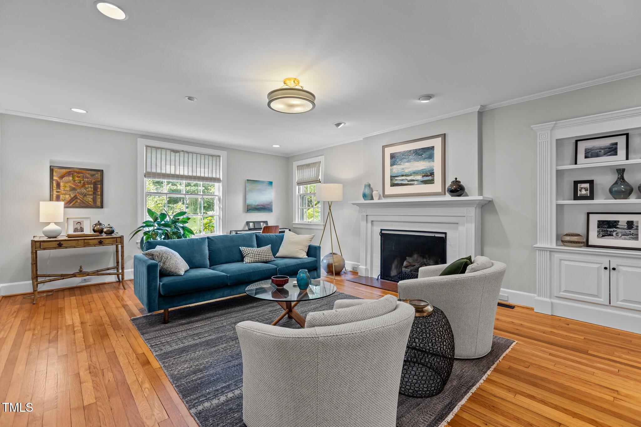 2706 Stuart Drive Durham, NC 27707 - Photo 5 of 26 a living room with furniture and a fireplace