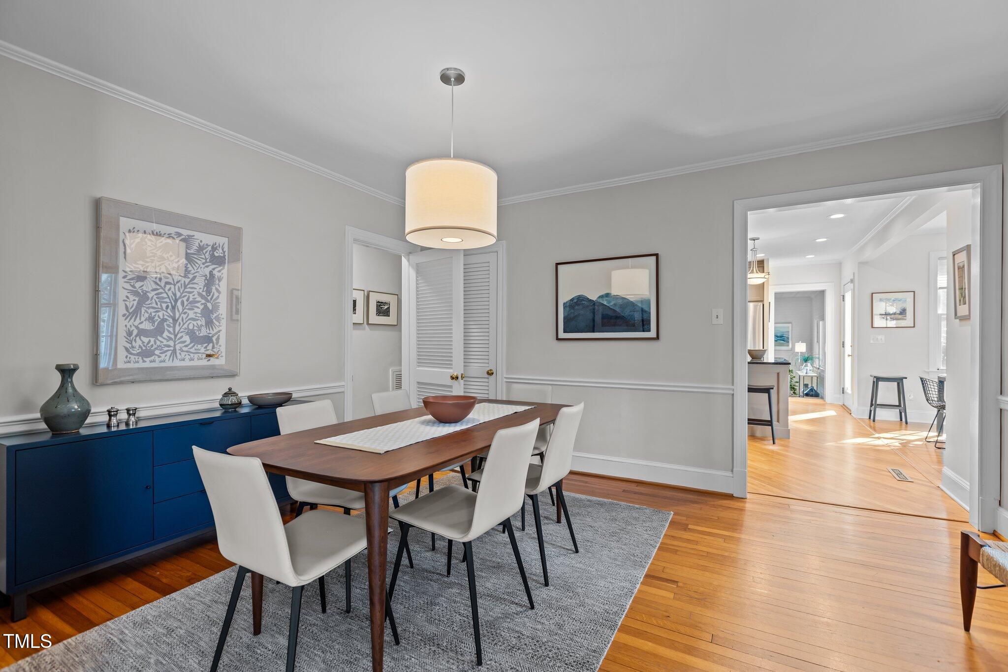 2706 Stuart Drive Durham, NC 27707 - Photo 7 of 26 a view of a dining room with furniture and wooden floor