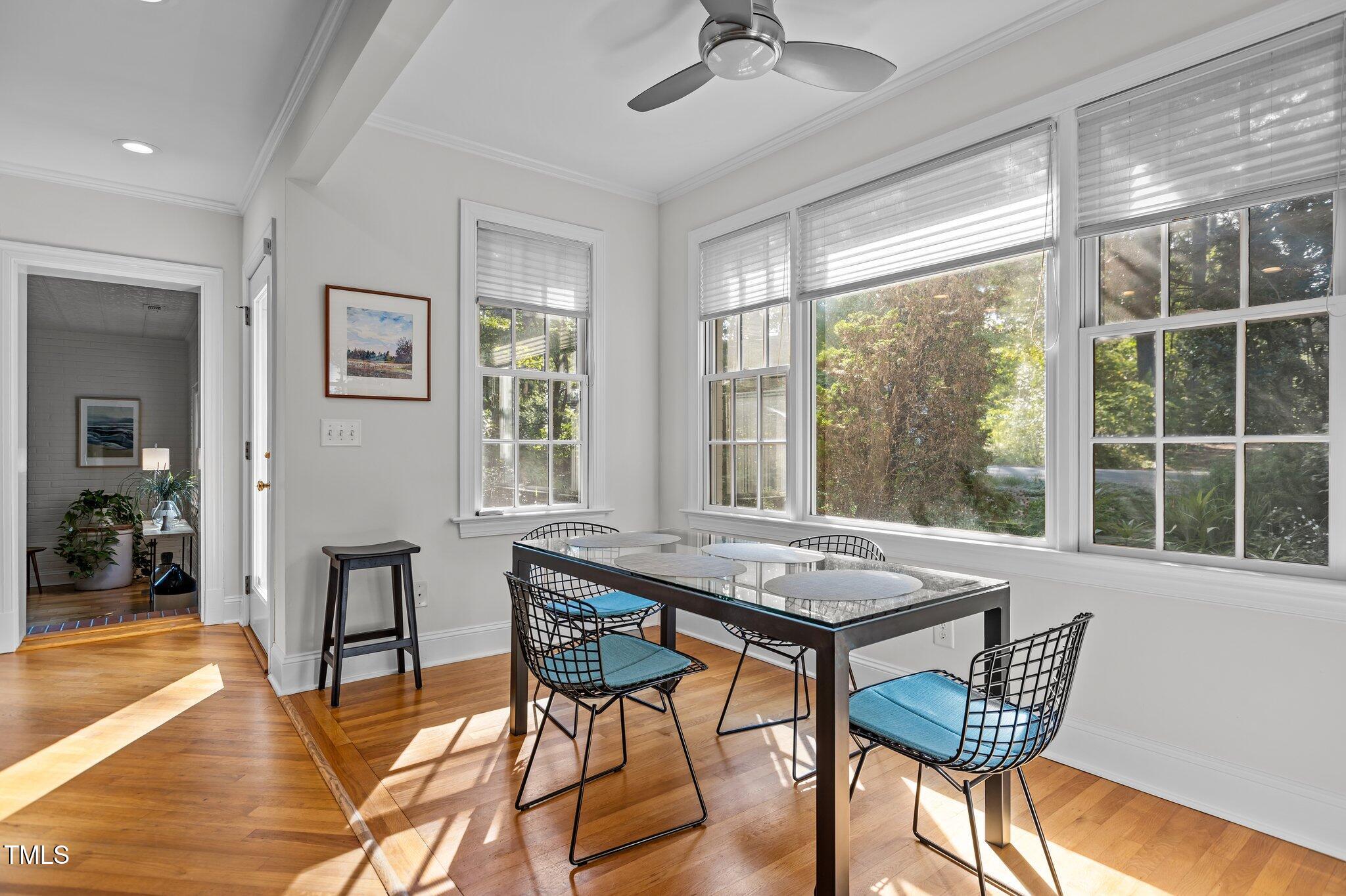 2706 Stuart Drive Durham, NC 27707 - Photo 10 of 26 a view of a dining room with furniture window and wooden floor