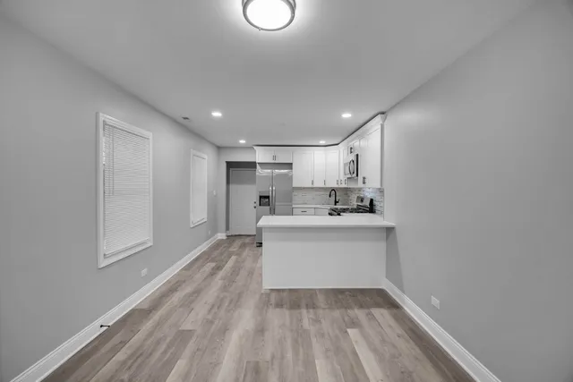 a view of a livingroom with wooden floor