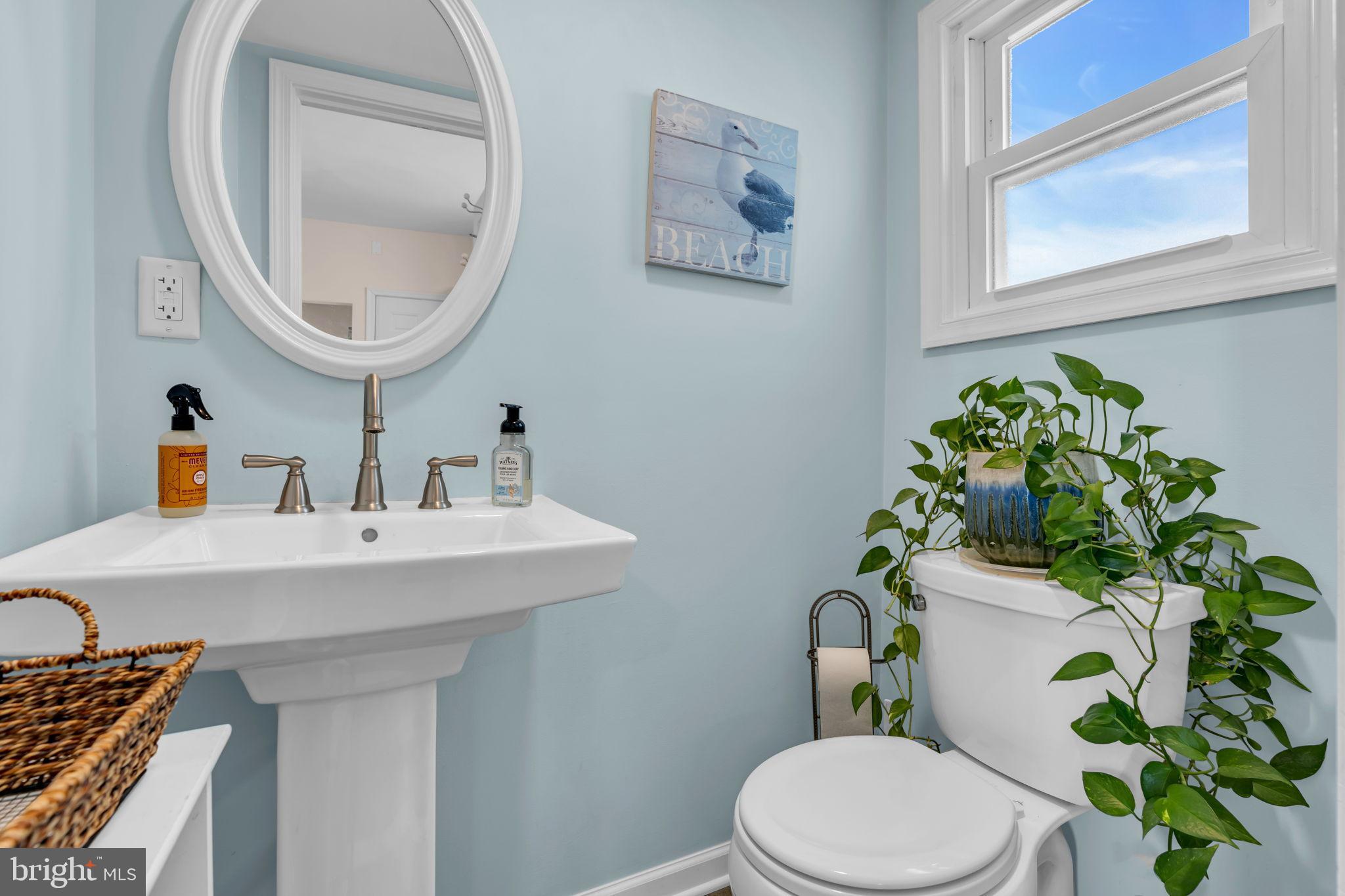 6 Beach Street Sea Bright, NJ 07760 - Photo 11 of 26 a bathroom with a toilet sink and mirror