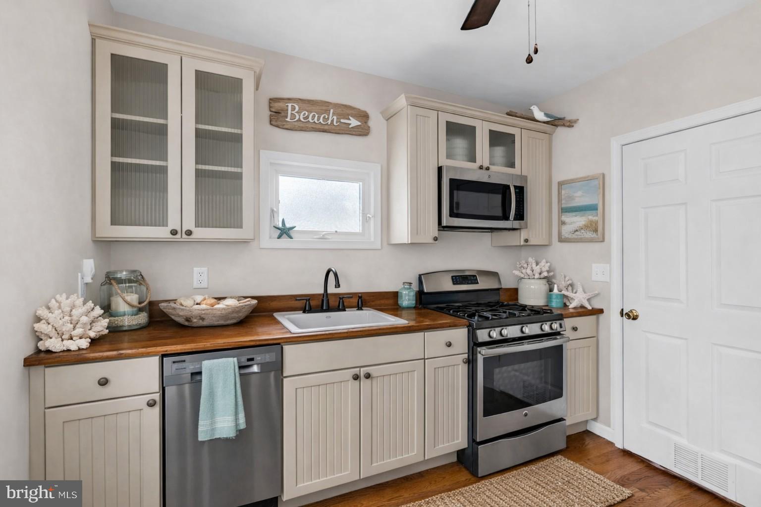 6 Beach Street Sea Bright, NJ 07760 - Photo 12 of 26 a kitchen with stainless steel appliances granite countertop a stove and a microwave