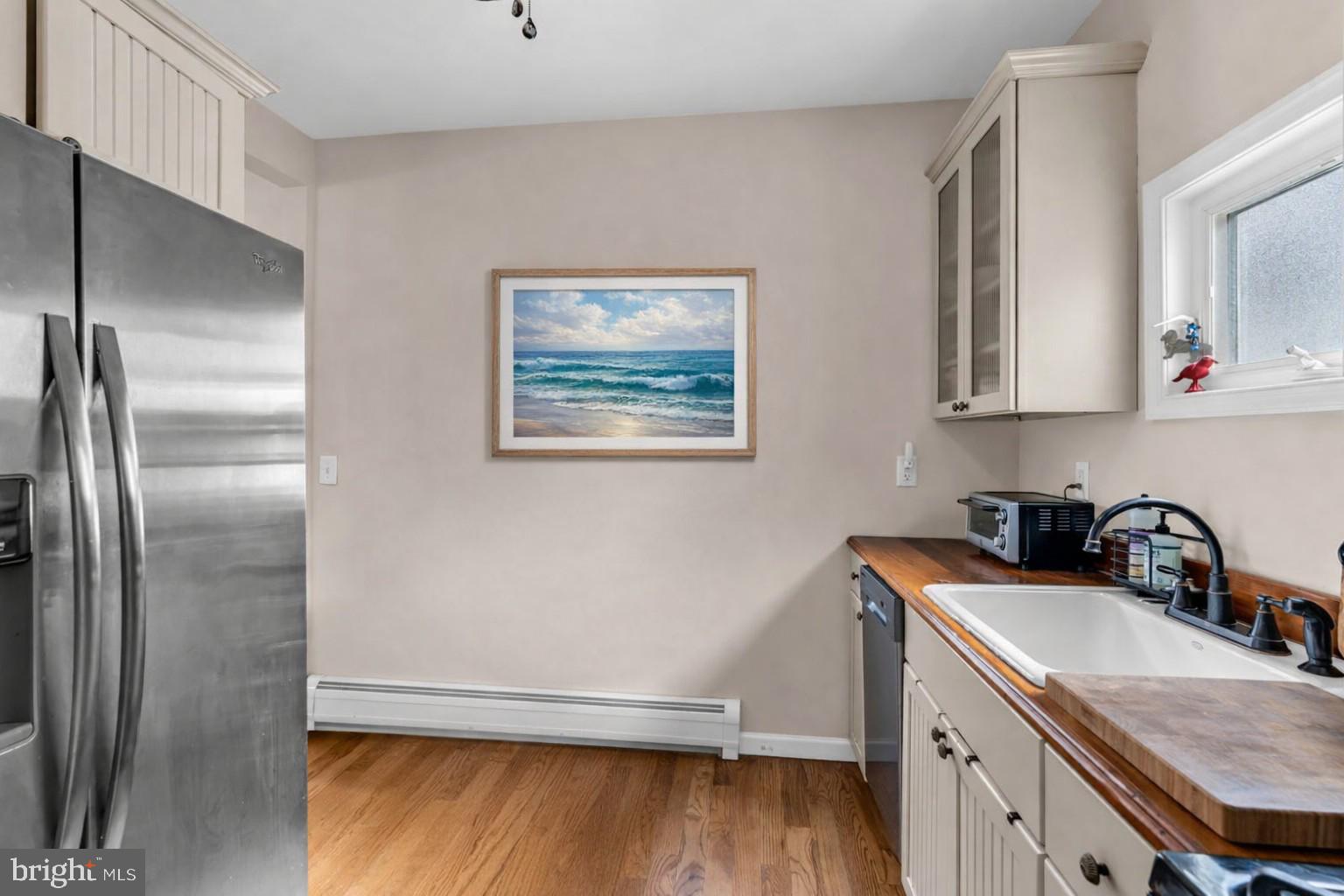 6 Beach Street Sea Bright, NJ 07760 - Photo 14 of 26 a kitchen with a sink refrigerator and cabinets