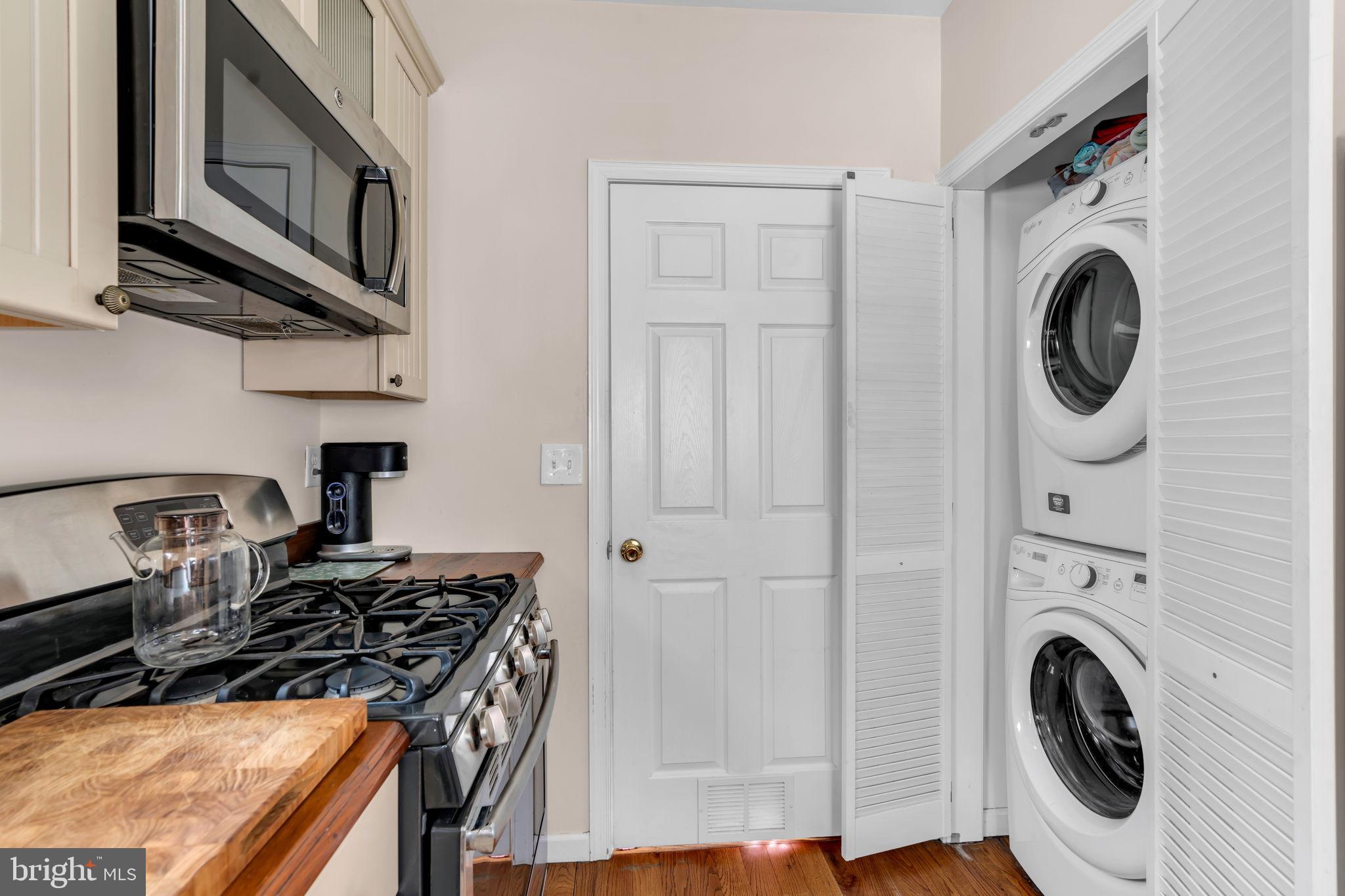 6 Beach Street Sea Bright, NJ 07760 - Photo 15 of 26 a kitchen with stove top oven and cabinets