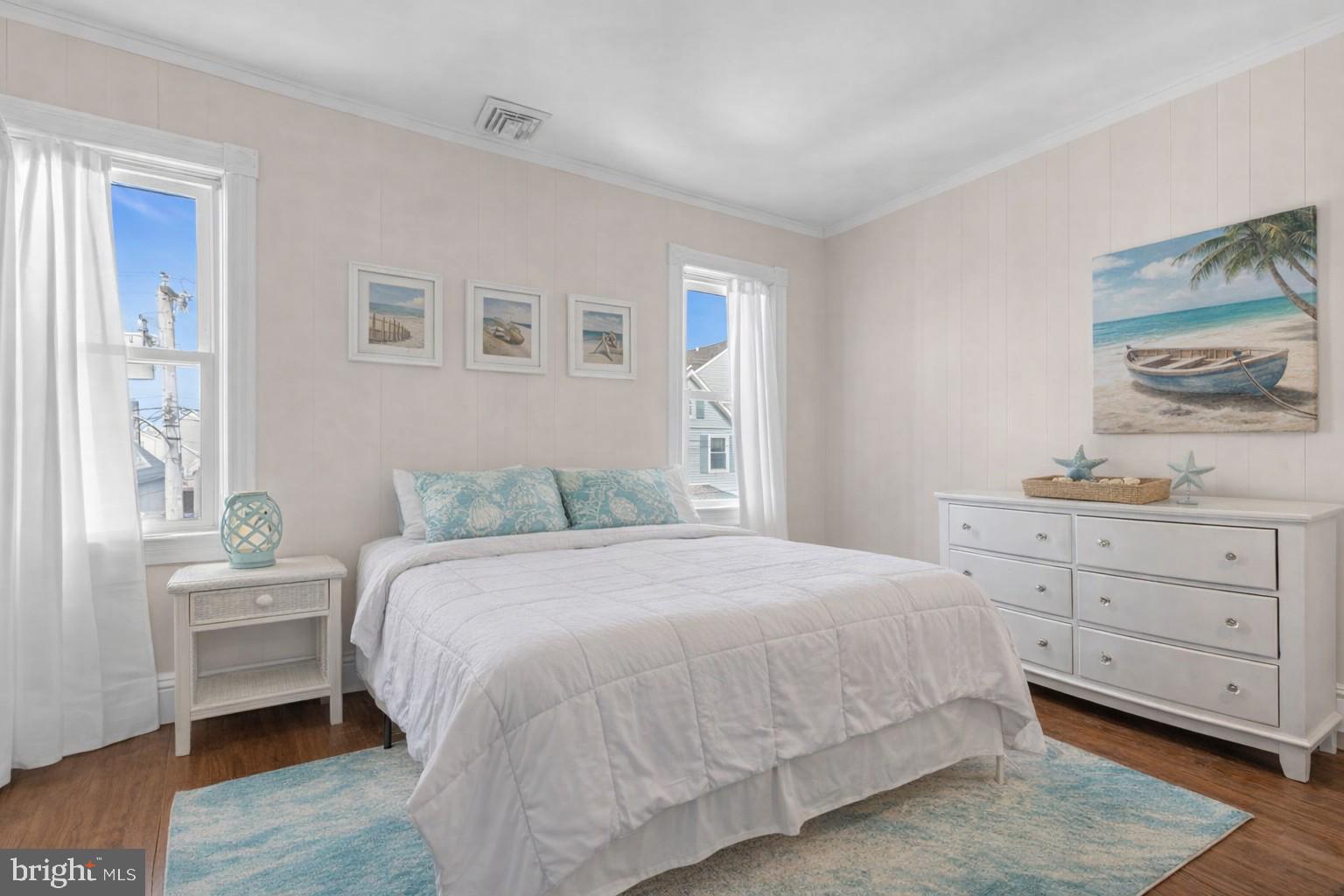 6 Beach Street Sea Bright, NJ 07760 - Photo 16 of 26 a bedroom with a bed and a dresser
