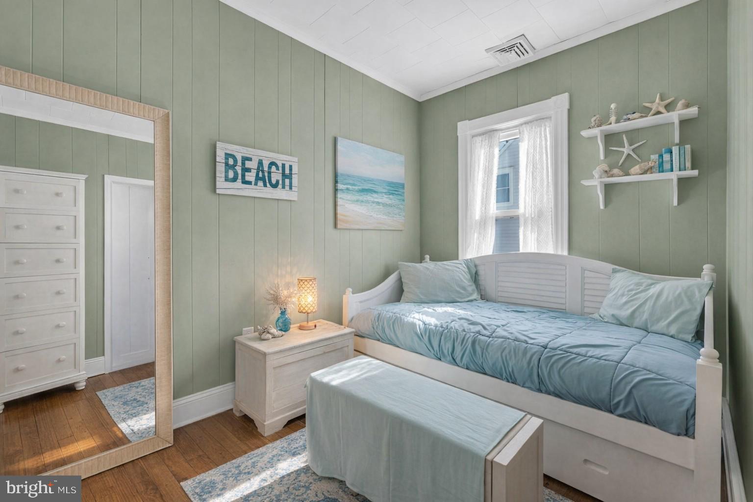6 Beach Street Sea Bright, NJ 07760 - Photo 17 of 26 a living room with furniture and painting on the wall