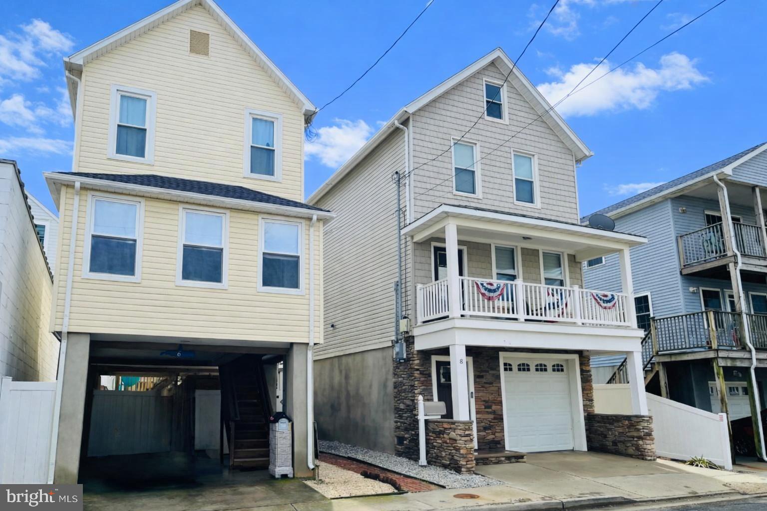 6 Beach Street Sea Bright, NJ 07760 - Photo 2 of 26 a front view of a building with many windows