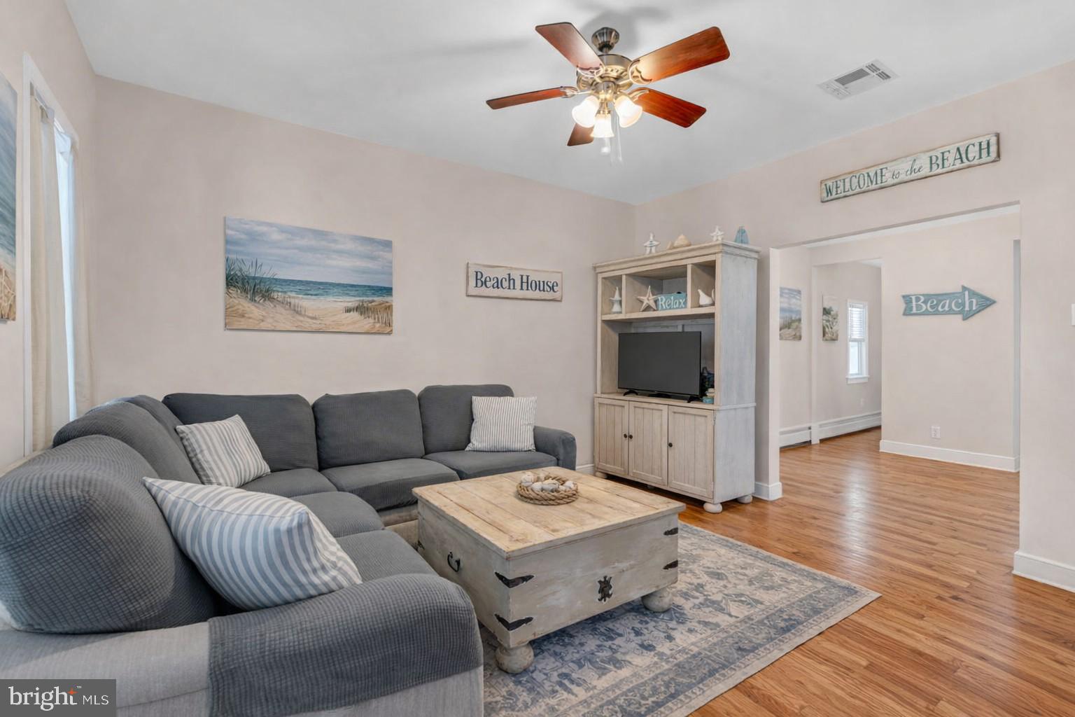 6 Beach Street Sea Bright, NJ 07760 - Photo 7 of 26 a living room with furniture and a flat screen tv