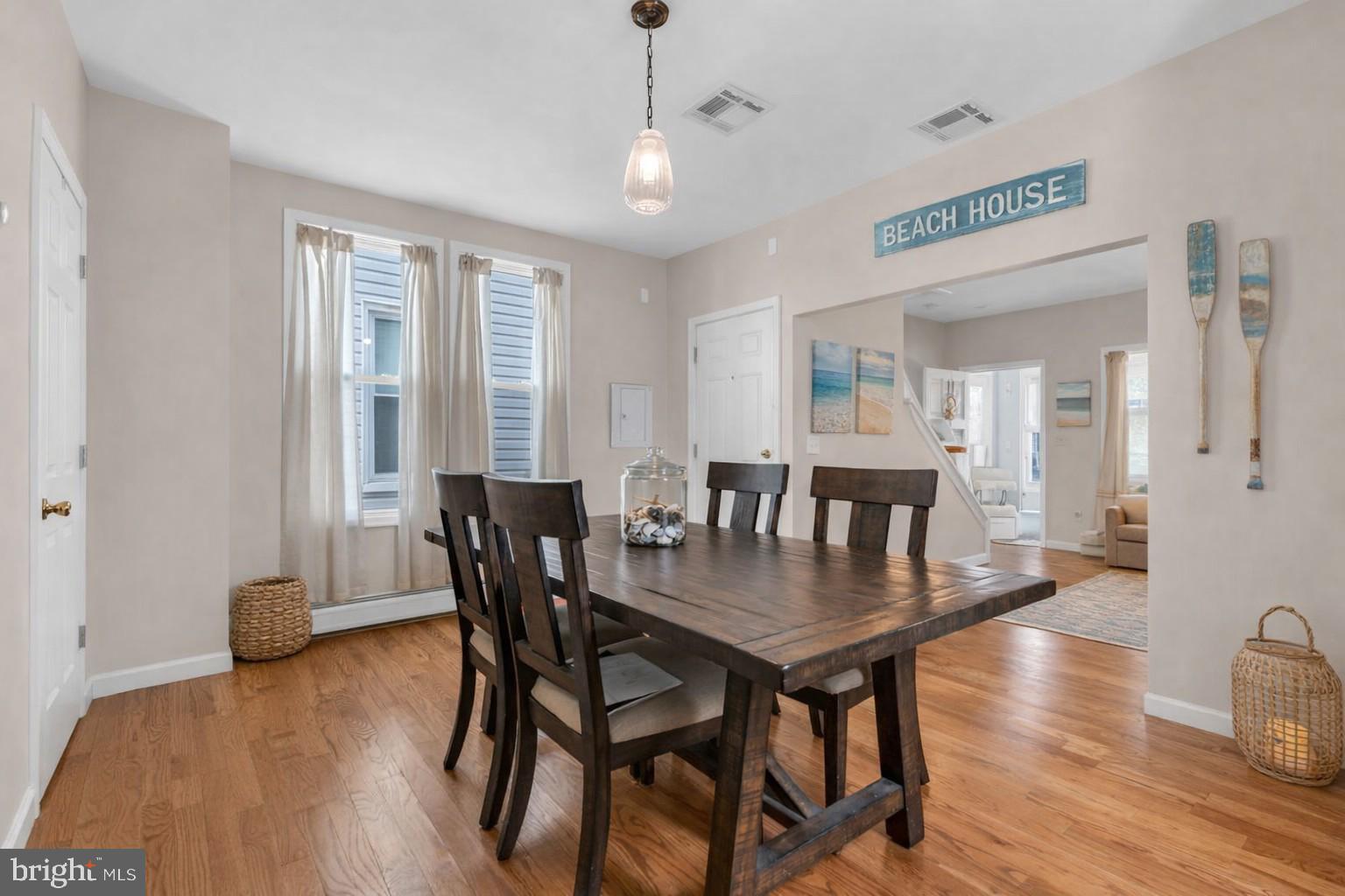 6 Beach Street Sea Bright, NJ 07760 - Photo 8 of 26 a view of a dining room with furniture window and wooden floor
