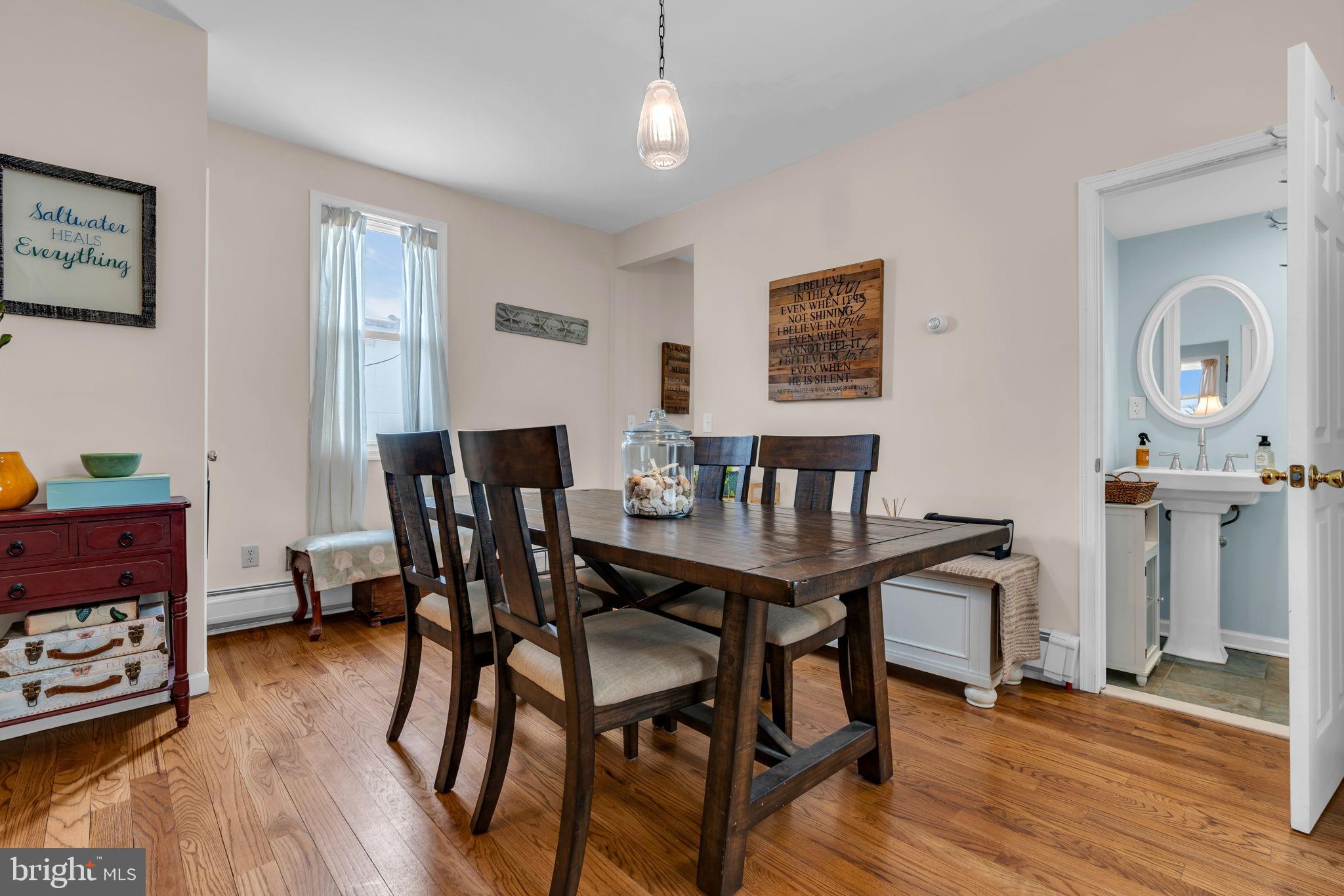 6 Beach Street Sea Bright, NJ 07760 - Photo 10 of 26 a view of a dining room with furniture and wooden floor
