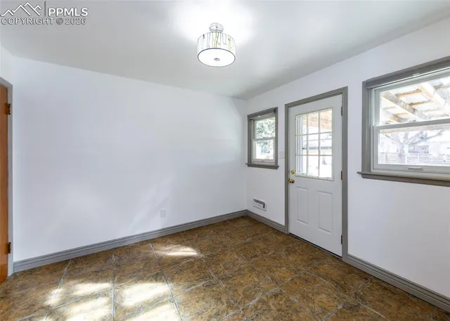 a view of empty room with windows