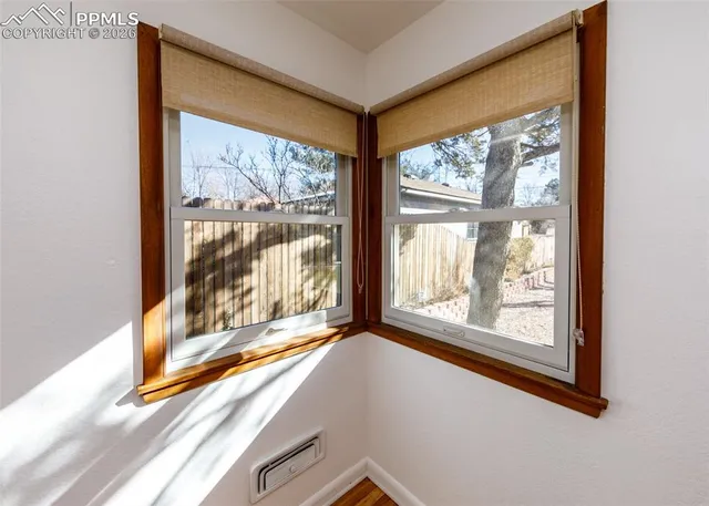 a view of a room that has a large window