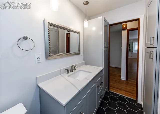 a bathroom with a sink and a mirror
