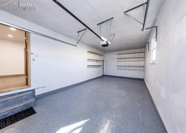 a view of an empty room and a window