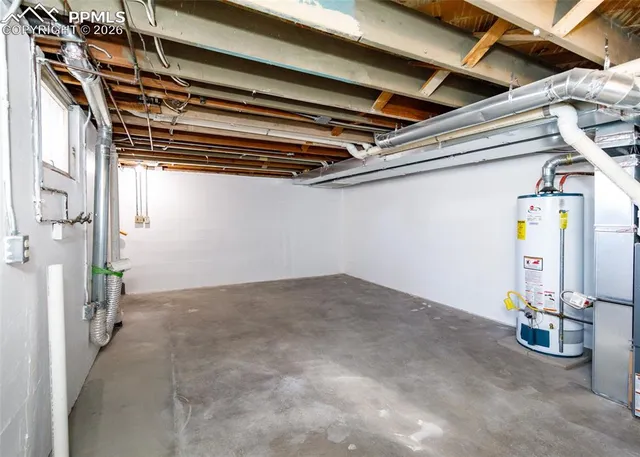 a view of a house with backyard and a garage