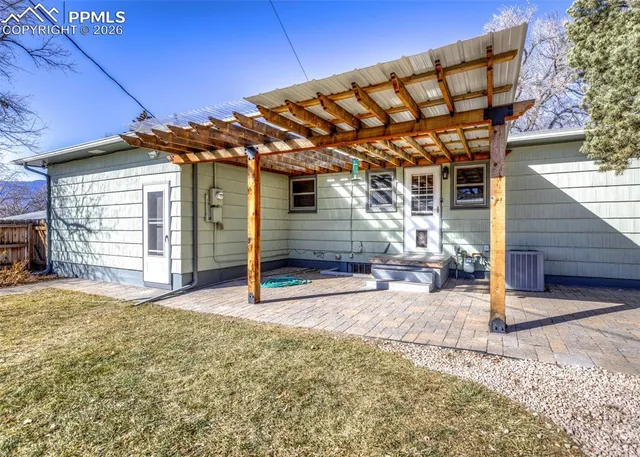 a view of a backyard of the house