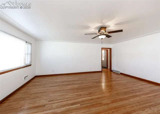 a view of an empty room with a window