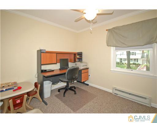 15 Hill Road Edison, NJ 08817 - Photo 12 of 13 a living room with furniture and a window