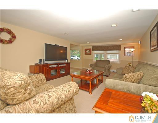 15 Hill Road Edison, NJ 08817 - Photo 5 of 13 a living room with furniture and a flat screen tv