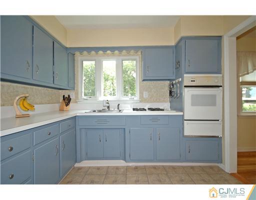 15 Hill Road Edison, NJ 08817 - Photo 6 of 13 a kitchen with a refrigerator stove and sink