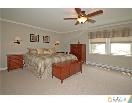 15 Hill Road Edison, NJ 08817 - Photo 7 of 13 a living room with a bed furniture and a window