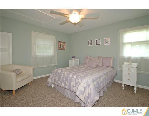15 Hill Road Edison, NJ 08817 - Photo 9 of 13 a bedroom with a bed and a couch