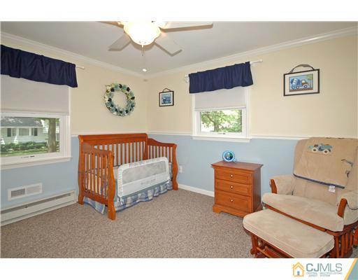15 Hill Road Edison, NJ 08817 - Photo 10 of 13 a bedroom with furniture and a window