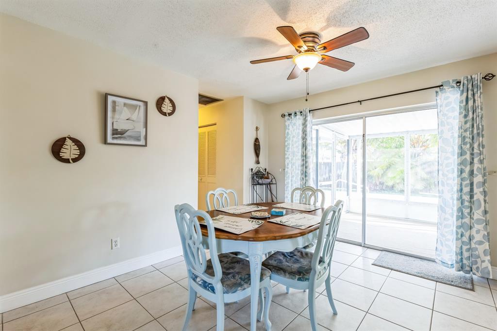 1153 Southeast Dolphin Drive Stuart, FL 34996 - Photo 12 of 31 a dining room with furniture and window