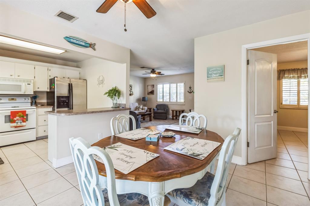 1153 Southeast Dolphin Drive Stuart, FL 34996 - Photo 13 of 31 a view of a dining room with furniture