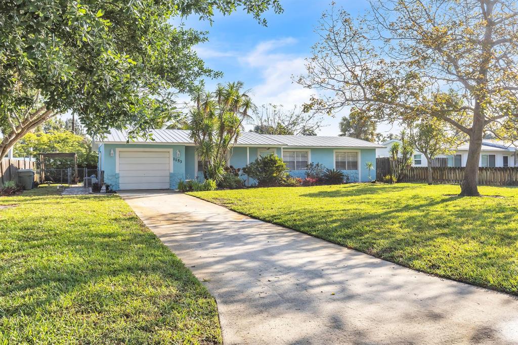 1153 Southeast Dolphin Drive Stuart, FL 34996 - Photo 2 of 31 a view of house with a swimming pool