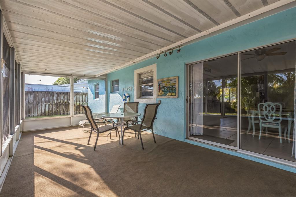 1153 Southeast Dolphin Drive Stuart, FL 34996 - Photo 24 of 31 a dining room with furniture and outdoor view