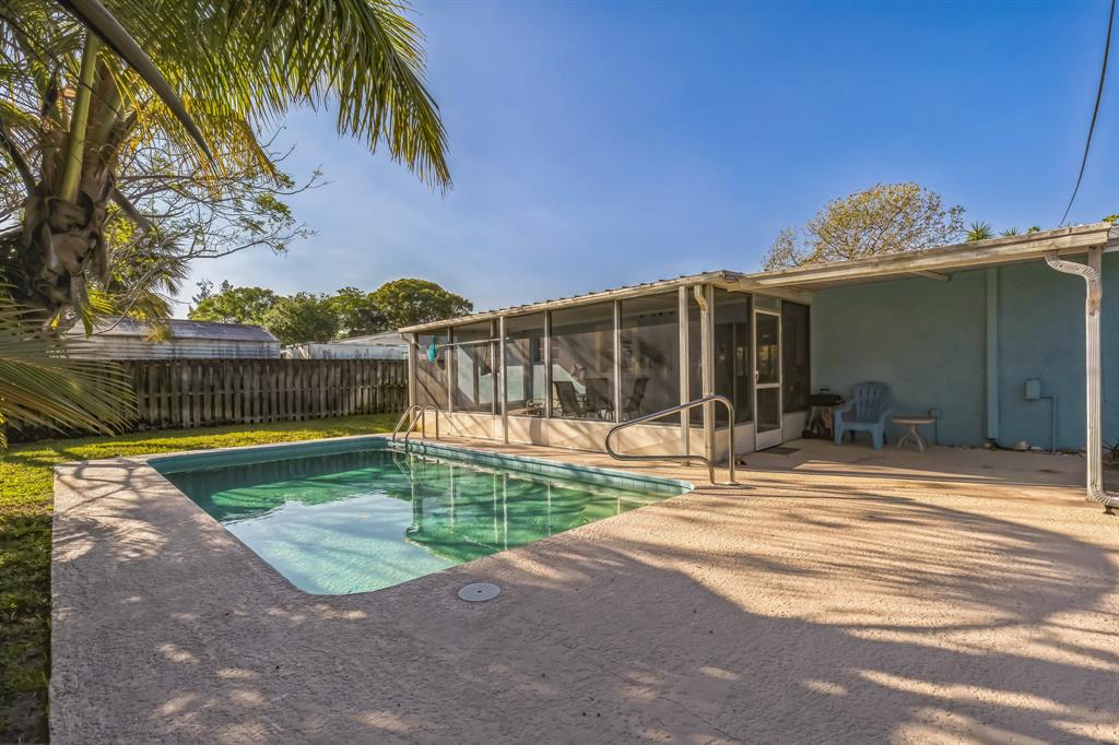 1153 Southeast Dolphin Drive Stuart, FL 34996 - Photo 29 of 31 a view of a backyard with a patio