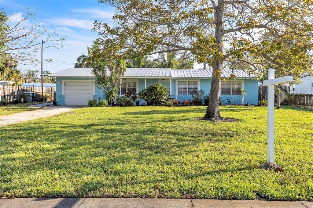 1153 Southeast Dolphin Drive Stuart, FL 34996 - Photo 3 of 31 a view of a house with a yard