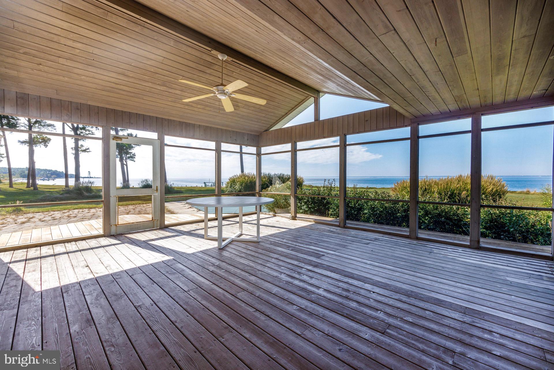5032 Black Walnut Point Road Tilghman, MD 21671 - Photo 14 of 34 Waterside screened porch