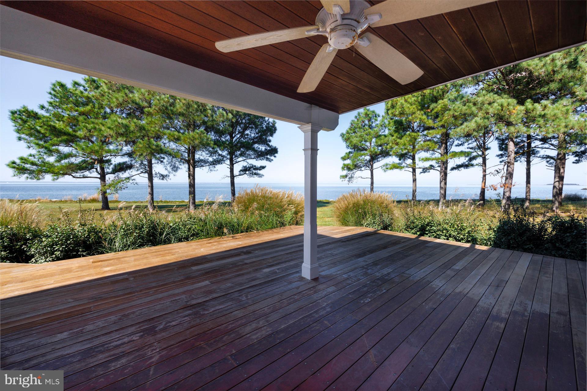 5032 Black Walnut Point Road Tilghman, MD 21671 - Photo 17 of 34 Covered waterside deck