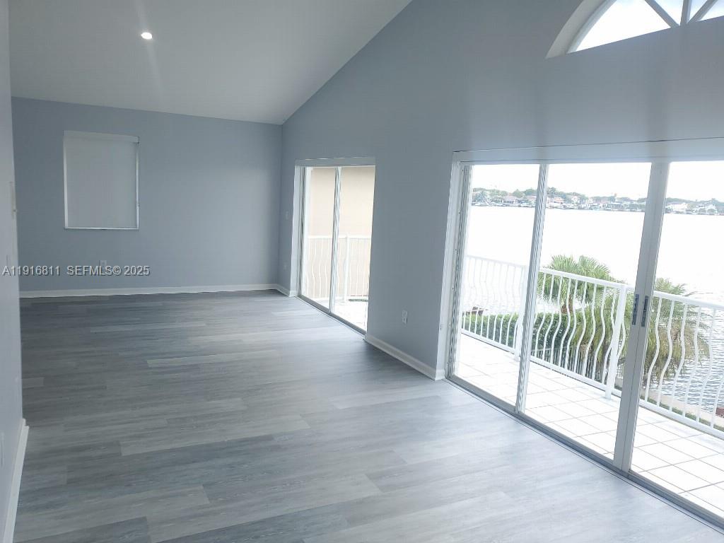 14765 Southwest 132nd Place Miami, FL 33186 - Photo 17 of 48 a view of entryway with wooden floor
