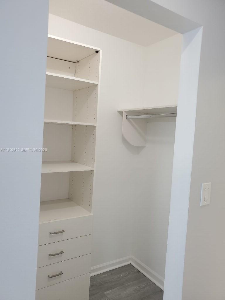 14765 Southwest 132nd Place Miami, FL 33186 - Photo 19 of 48 a view of an empty walk in closet