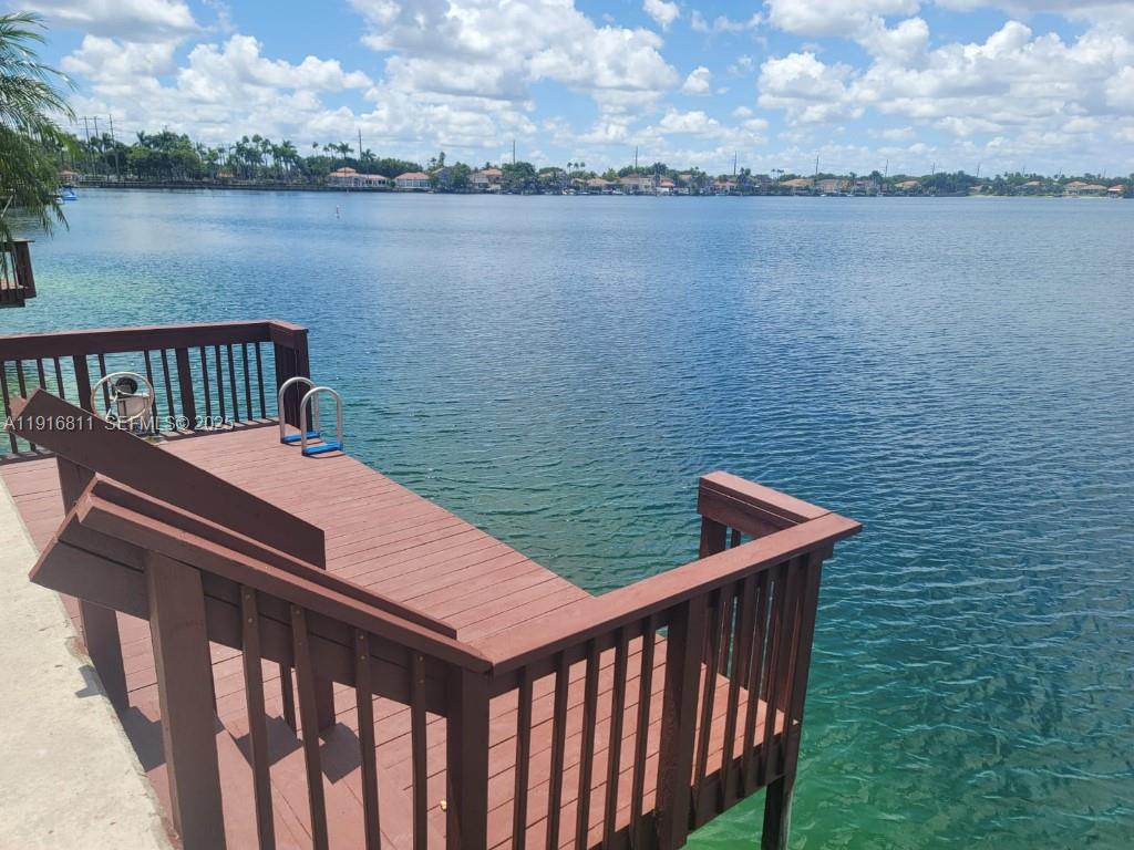 14765 Southwest 132nd Place Miami, FL 33186 - Photo 27 of 48 a view of a roof deck with lake and city view