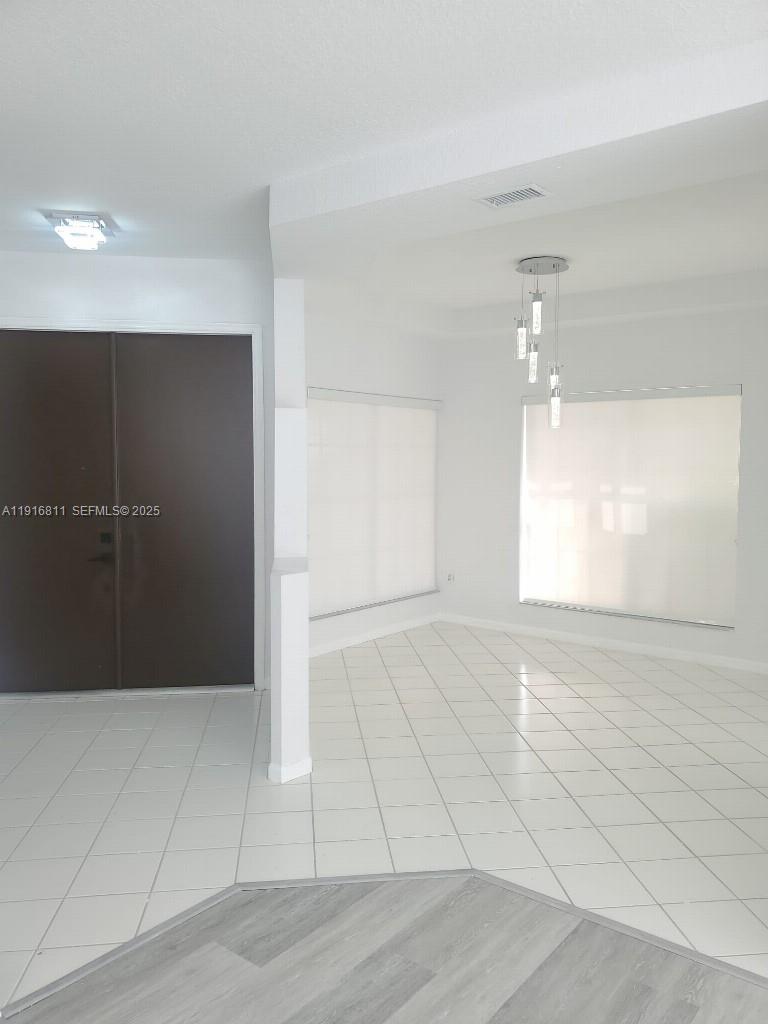 14765 Southwest 132nd Place Miami, FL 33186 - Photo 3 of 48 wooden floor in an empty room