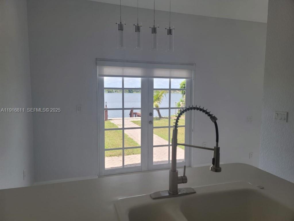 14765 Southwest 132nd Place Miami, FL 33186 - Photo 36 of 48 a decorative lighting & window in an empty room