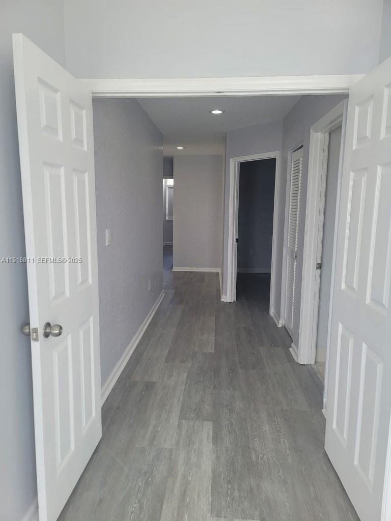 14765 Southwest 132nd Place Miami, FL 33186 - Photo 42 of 48 a view of a hallway with wooden floor
